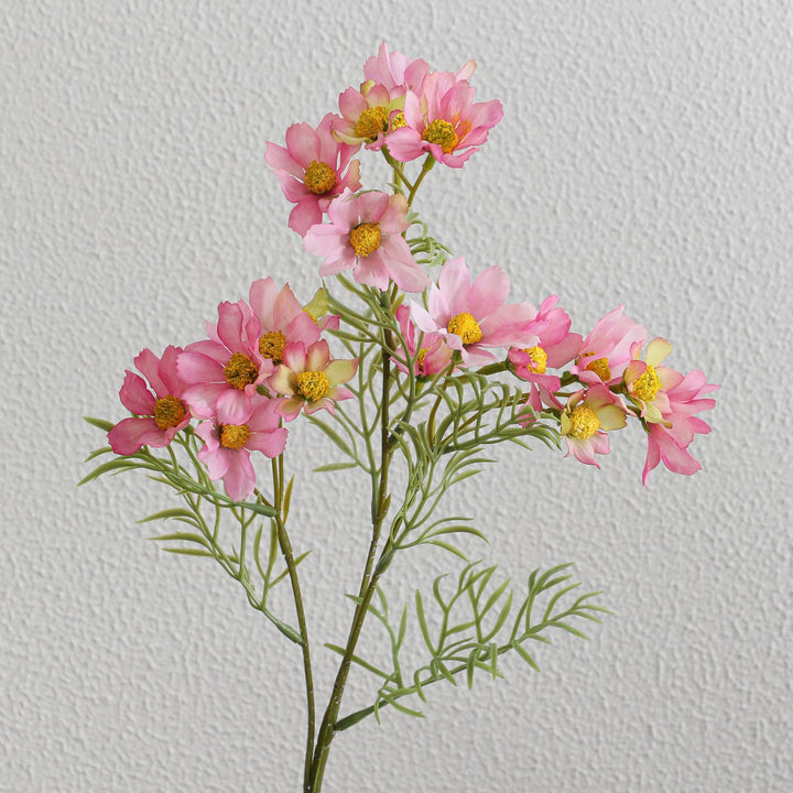 Artificial flower branch with bright pink flowers