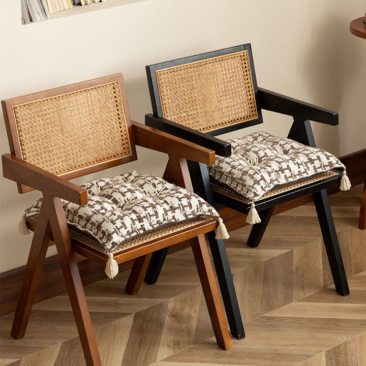 Decorative woven seat cushion with tufting and tassels