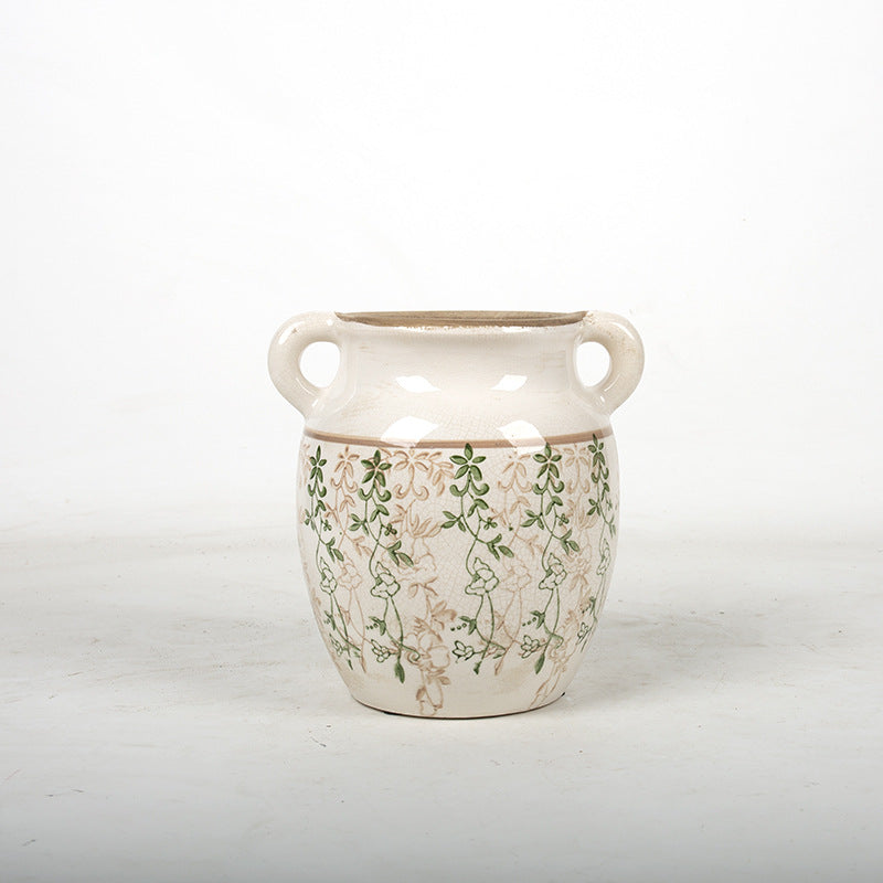 Decorative plant pot with floral accents