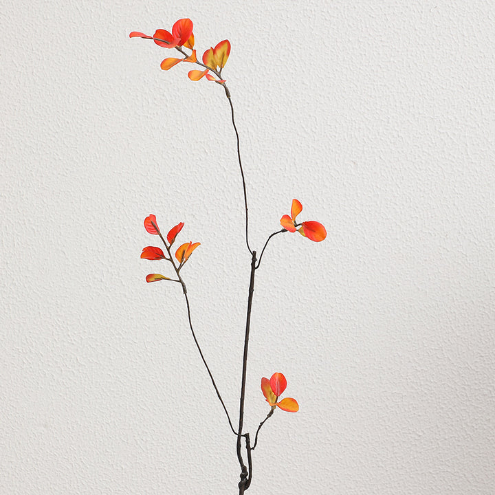 Artificial flower branch with vibrant orange flowers