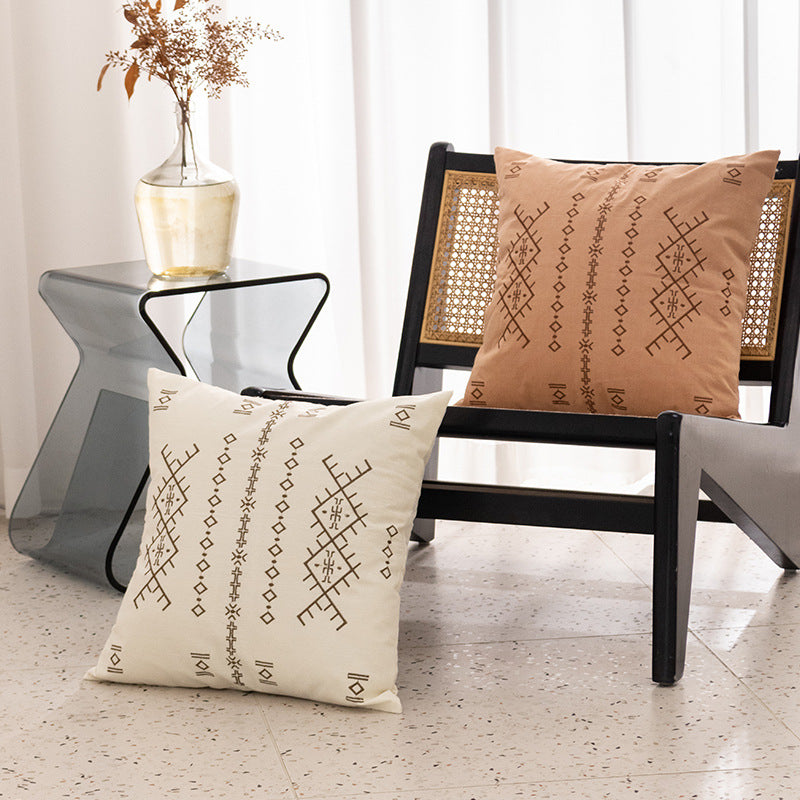 Square decorative cushion with fine relief embroidery in ethnic design and removable cover
