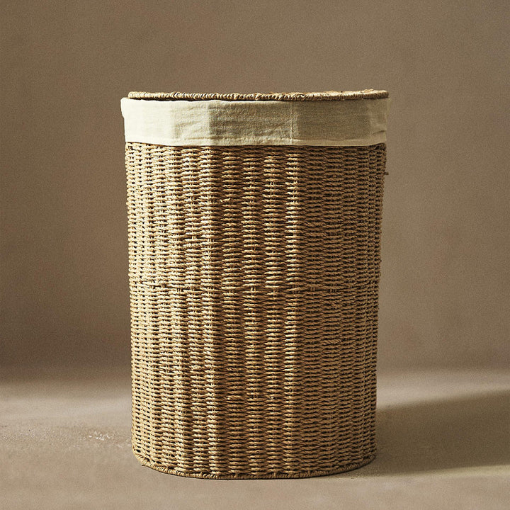 Round laundry basket made of natural materials