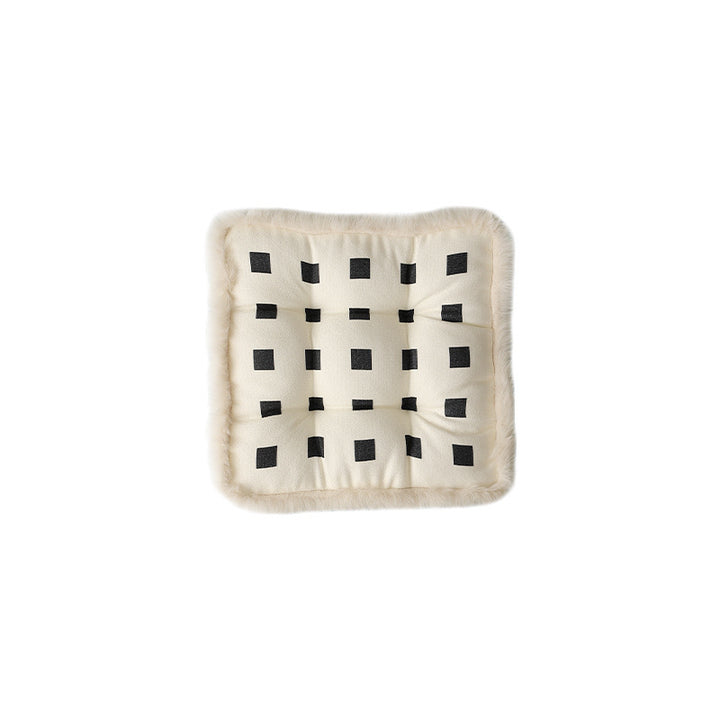 Padded seat cushion with fastening straps, quilted tufting surface and faux fur trim