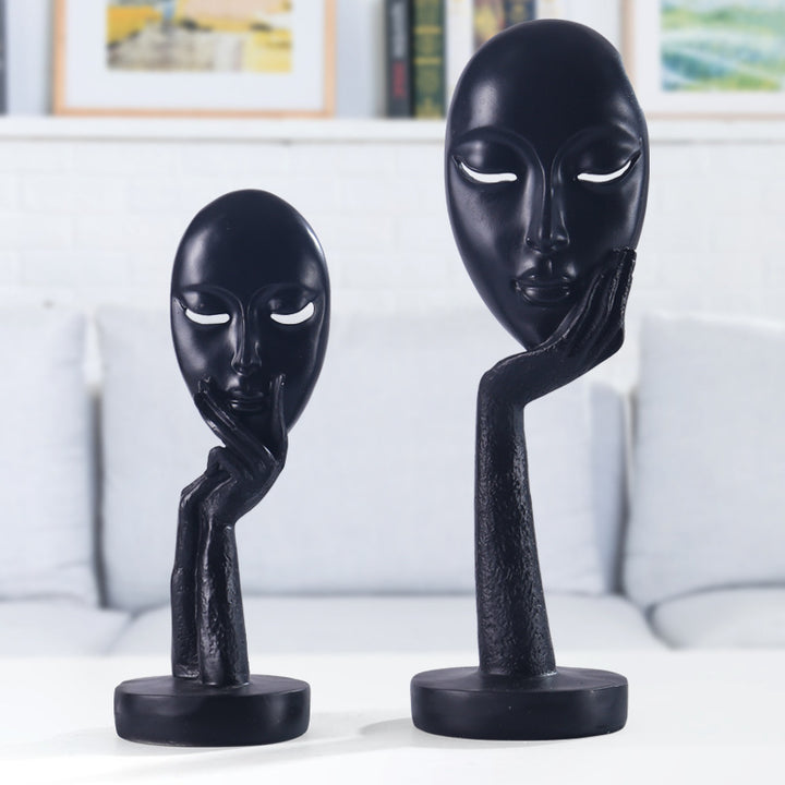 Artful decoration in the form of a contemplative figure