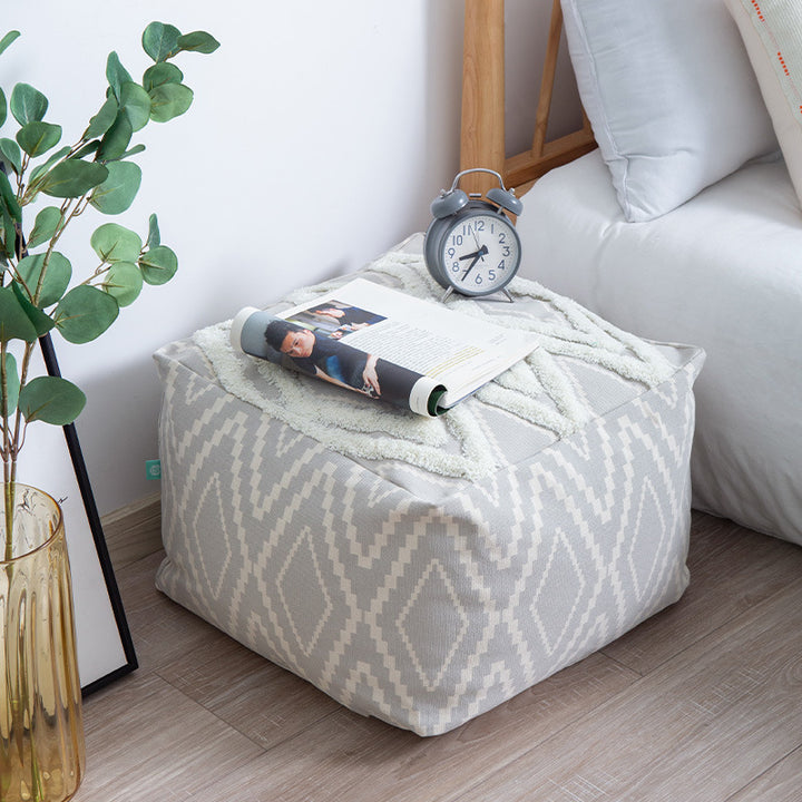 Cubical seat pouf made of woven cotton blend with ethnic diamond pattern