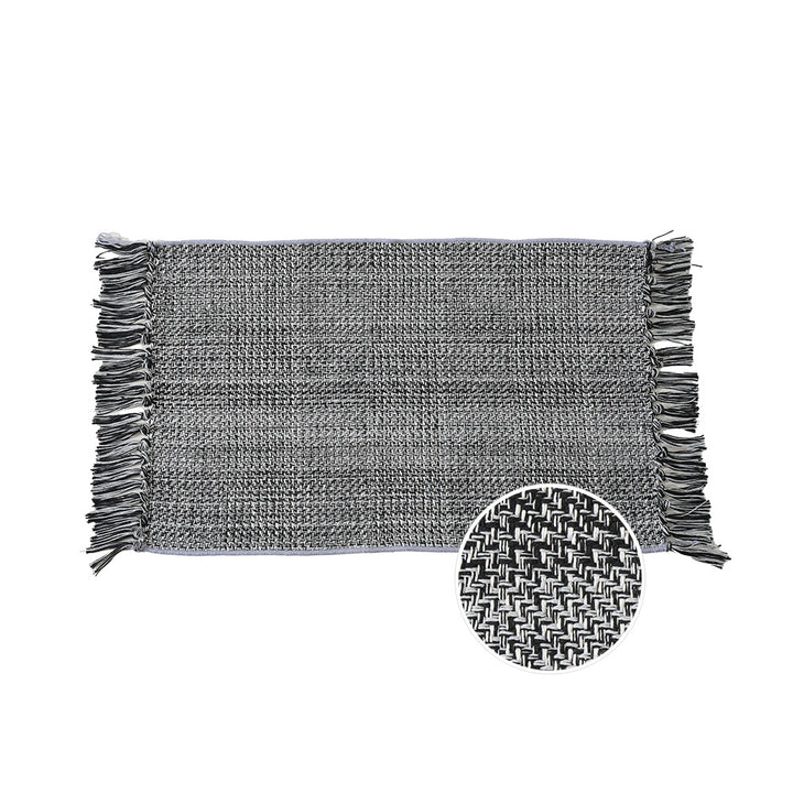 Woven table runner with dense herringbone jacquard and fringes