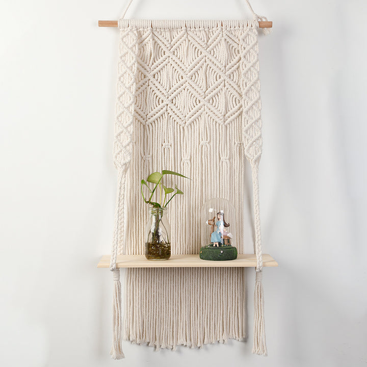 Macramé wall shelf with integrated plant holder
