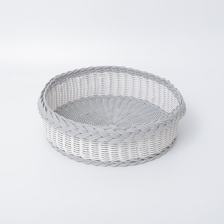 Handwoven storage basket with decorative edge