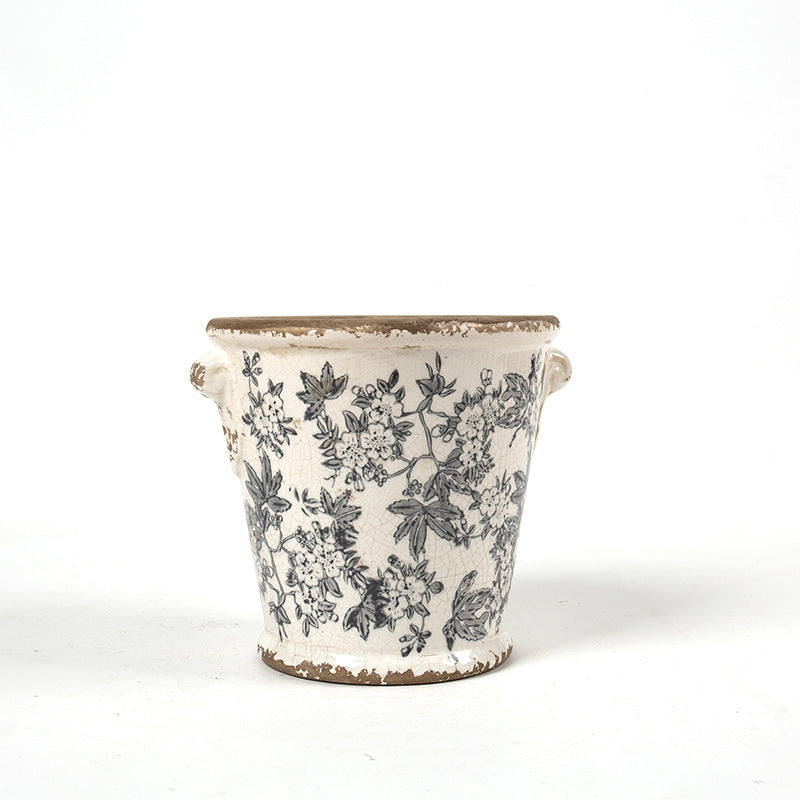 Decorative flower pot with floral embellishments
