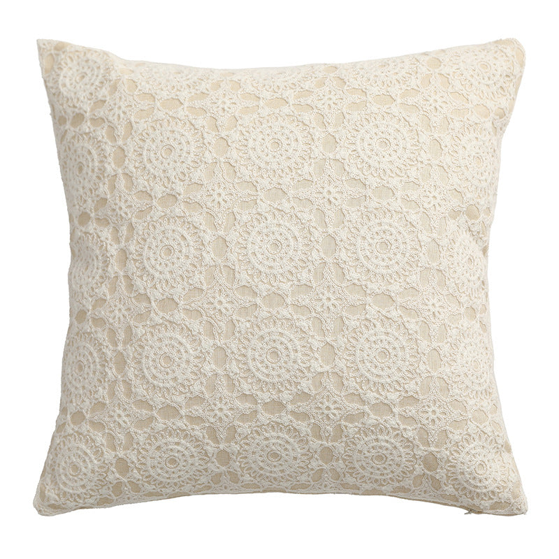 Square decorative cushion with crocheted ornament overlay and linen texture