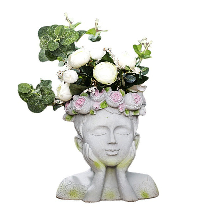 Decorative head with rosary