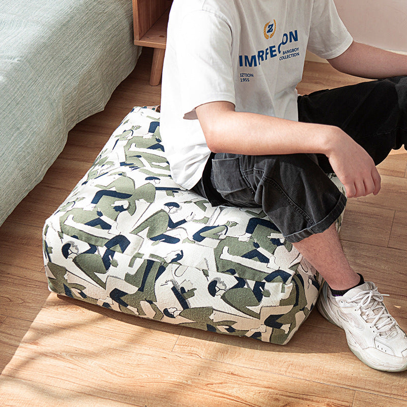 Seating pouf made of woven cotton blend with quilted diamond relief