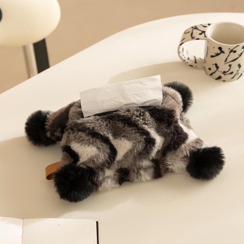 Cozy tissue box cover made of artificial fur with pom-pom application