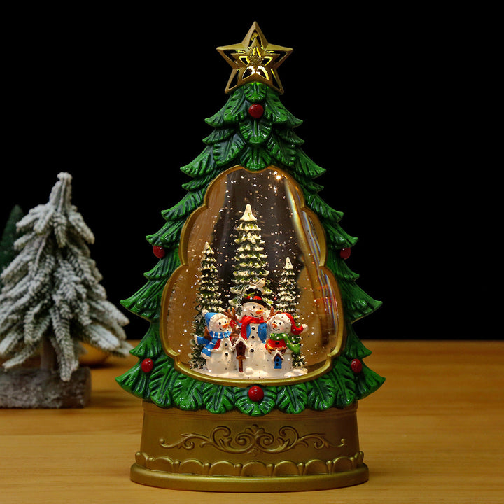 Illuminated Christmas lantern with snow and Christmas motif