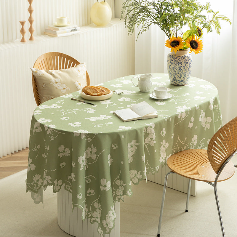 Round wipeable tablecloth with floral cut-out hem