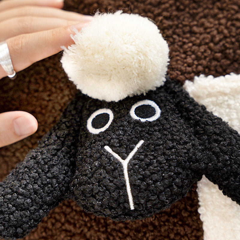 Round plush seat pouf with cute sheep appliqués and teddy fleece