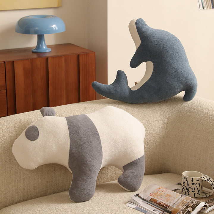 Playful dolphin cuddle pillow with ergonomic neck and arm recess