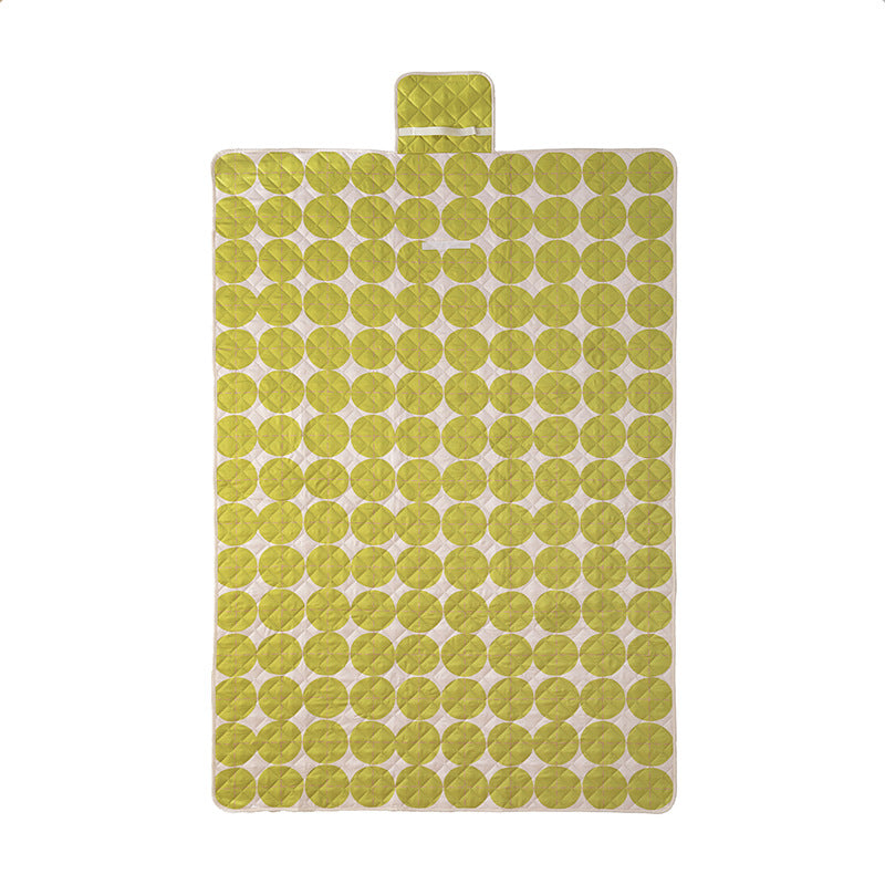Padded outdoor picnic blanket with quilting, carrying flap and lightweight water-repellent cover