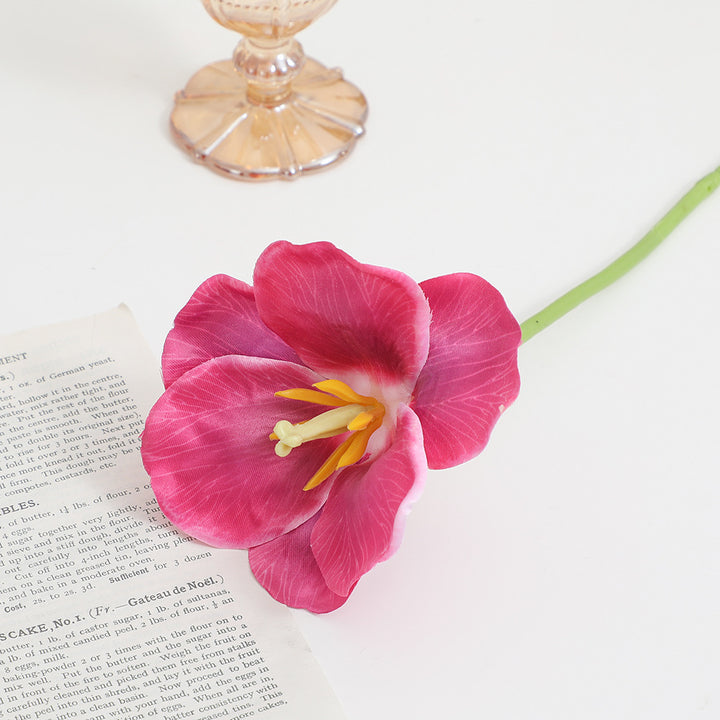 Artificial orchid flower branch with intricately detailed flowers