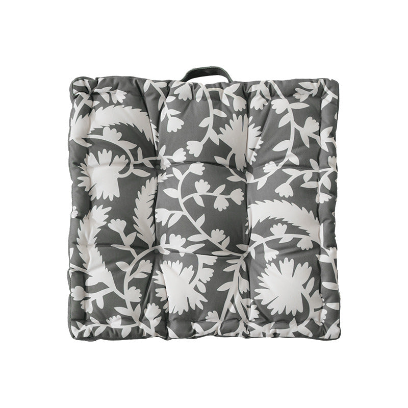 Padded chair cushion with carrying handle and decorative stitching