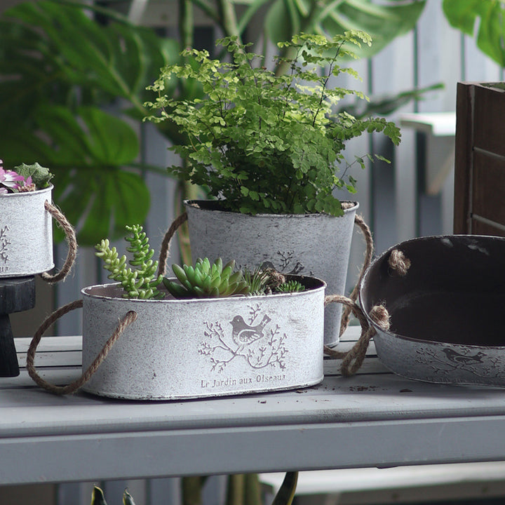 Decorative storage basket made of metal with natural design