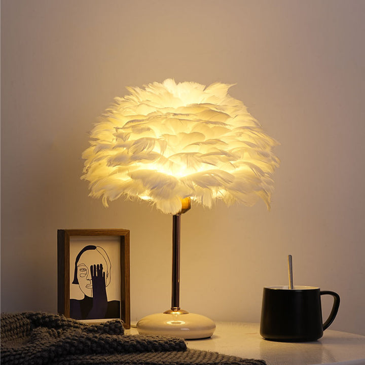 Feather shade table lamp with ceramic base and polished metal rod