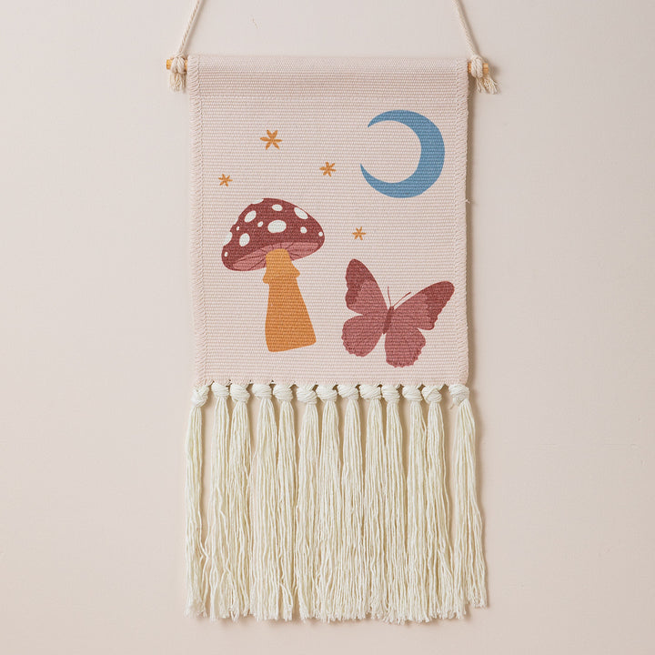 Woven wall hanging with hand-knotted fringes and bunny motif