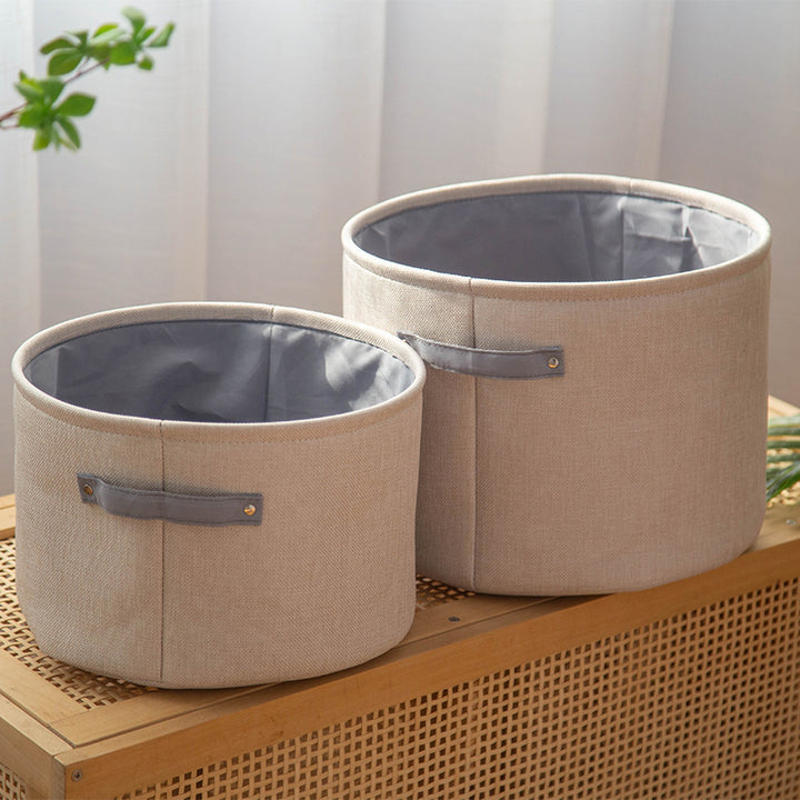Organizer basket with practical handle and water-repellent inner coating