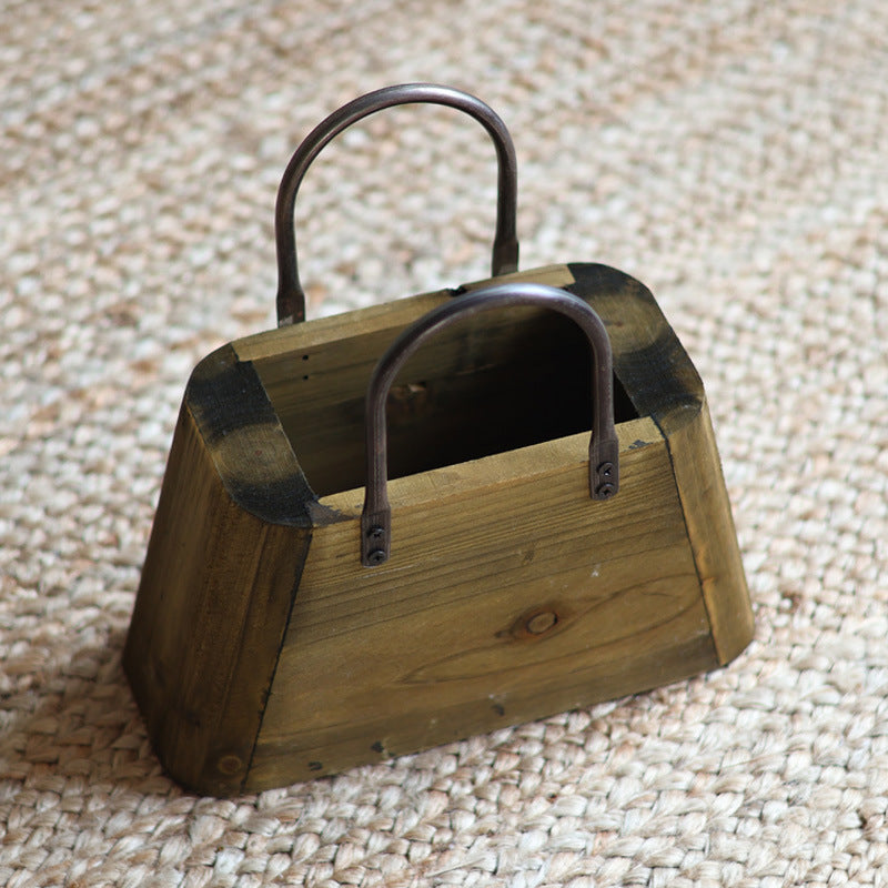 Handcrafted wooden basket with metal handles