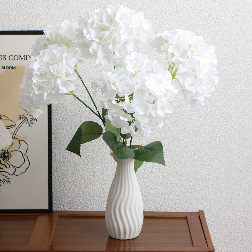 Decorative artificial flower arrangement