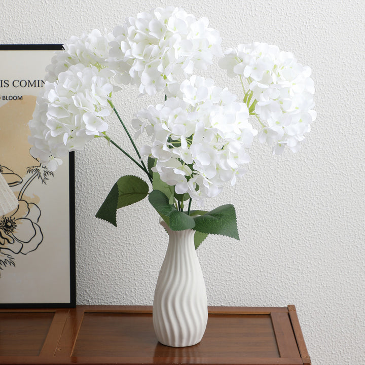 Decorative artificial flower arrangement