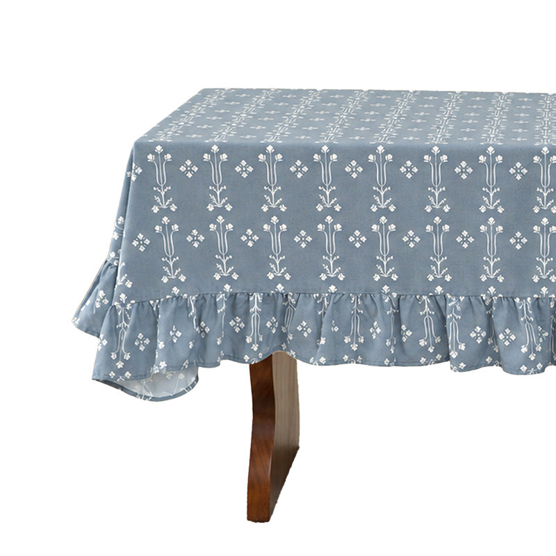 Rectangular tablecloth with ruffled border and delicate floral jacquard