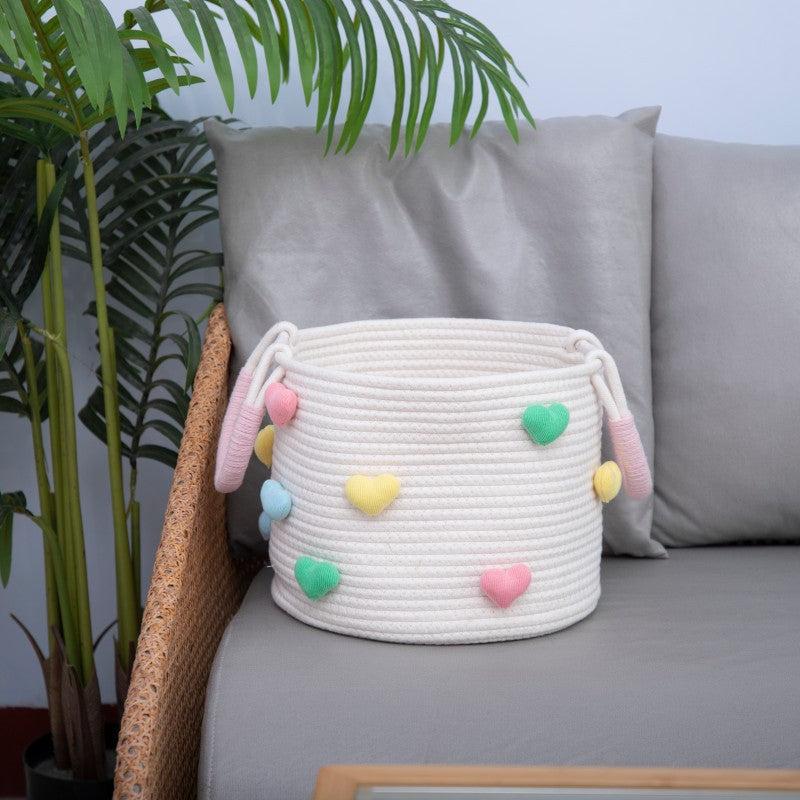 Playful storage basket with heart pattern