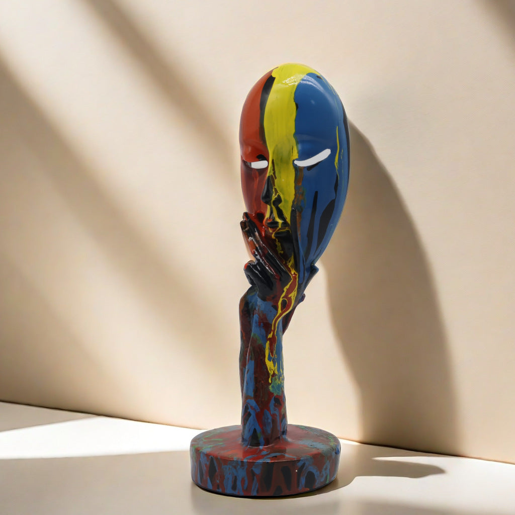 Artful decoration in the form of a contemplative figure