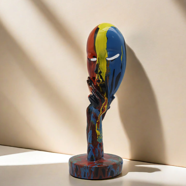 Artful decoration in the form of a contemplative figure