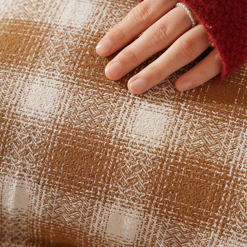 Decorative square cushion cover with pompom corners and checkered jacquard pattern