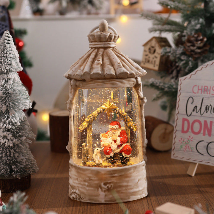 Illuminated Christmas lantern with snow scenes