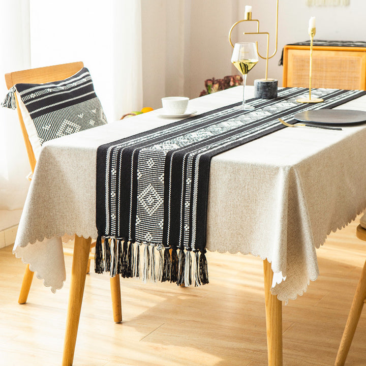 Handwoven table runner made of cotton blend with fringes and geometric dot jacquard