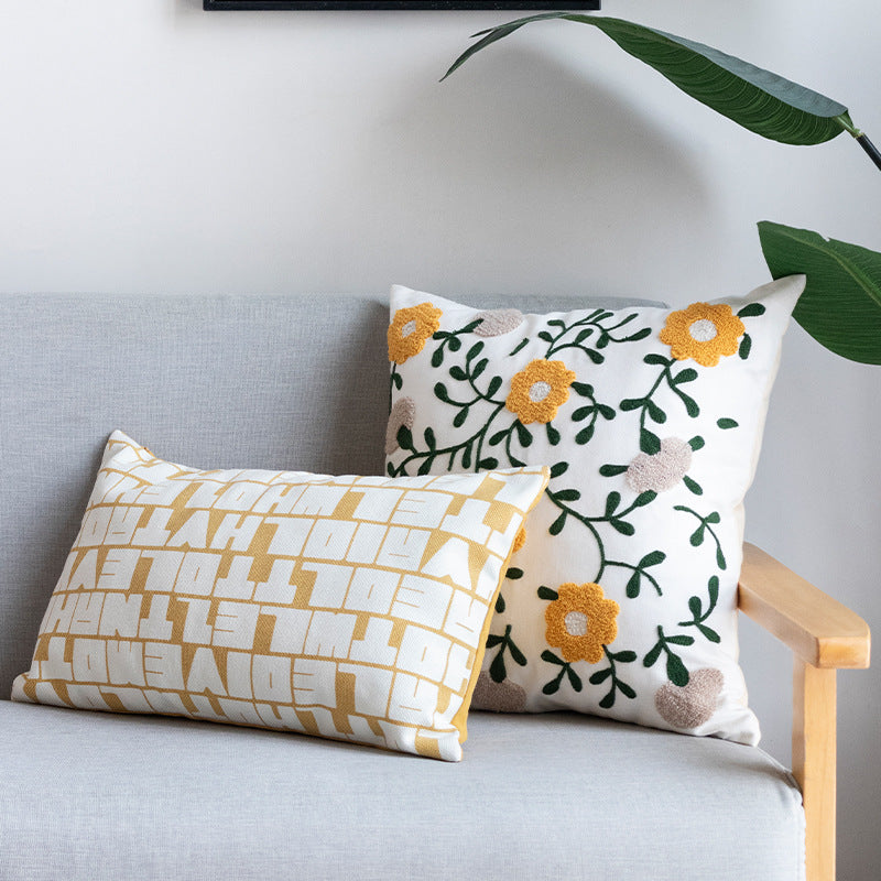 Rectangular decorative lumbar pillow with typographic jacquard pattern