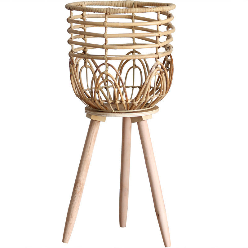 Stylish plant stand made of rattan and wood