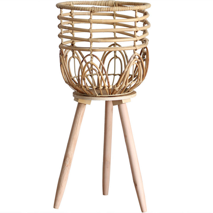 Stylish plant stand made of rattan and wood
