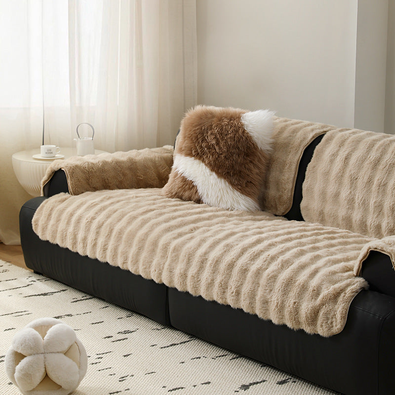 Luxurious sofa cover made of faux fur with ribbed texture