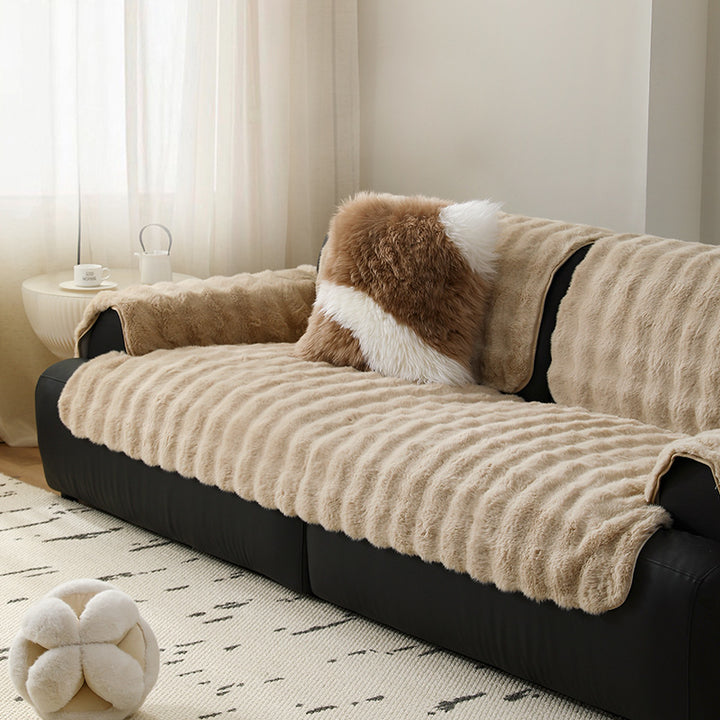 Luxurious sofa cover made of faux fur with ribbed texture