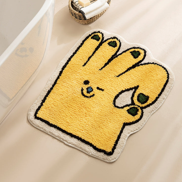 Shaped bath mat in hand shape with tufted chenille texture and non-slip underside