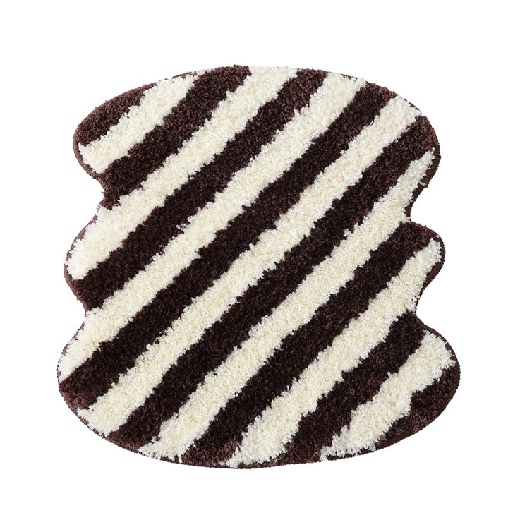 High-pile bath mat rug with diagonal stripe structure and organic shape