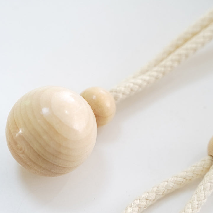 Elegant curtain holder with wooden beads