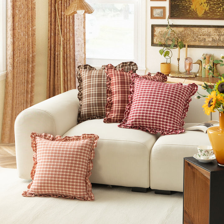 Decorative cushion with gingham pattern and playful ruffled edge