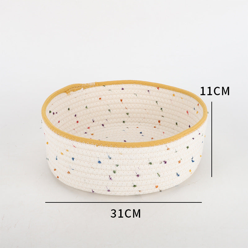 Storage basket made of natural cotton fabric with colorful dots