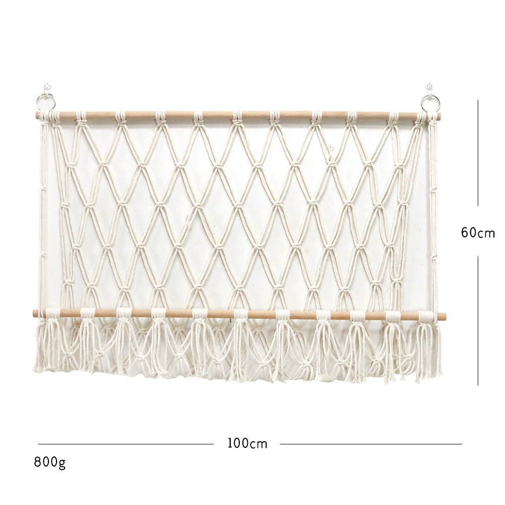 Elegant macramé wall hanging with decorative tassels and wooden frame