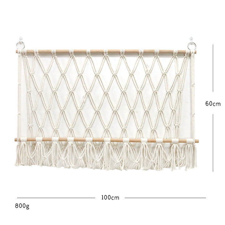 Elegant macramé wall hanging with decorative tassels and wooden frame
